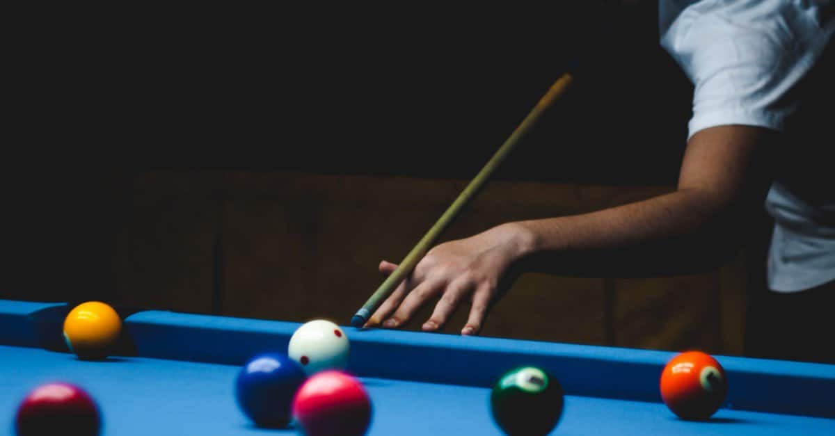person playing billiards