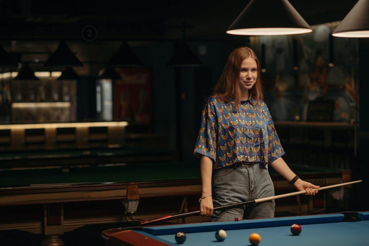 girl playing pool