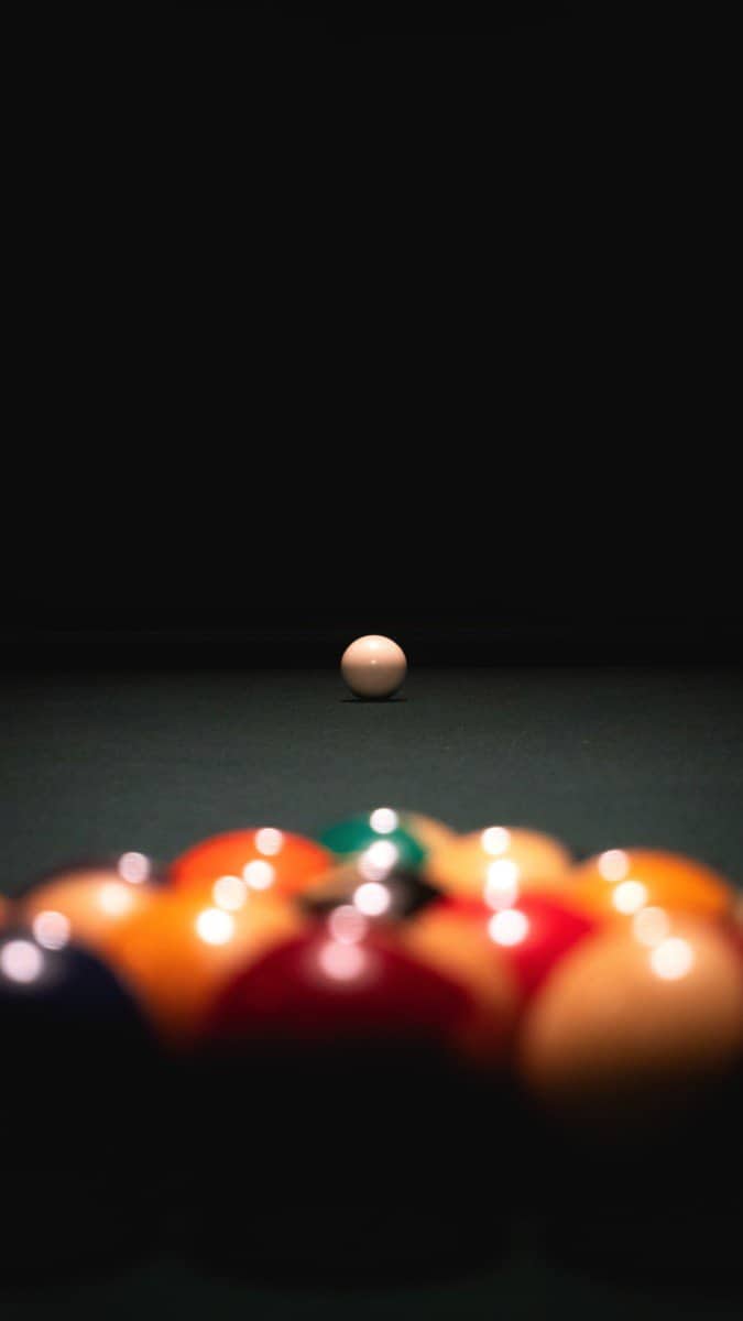 A set of pool balls about to break