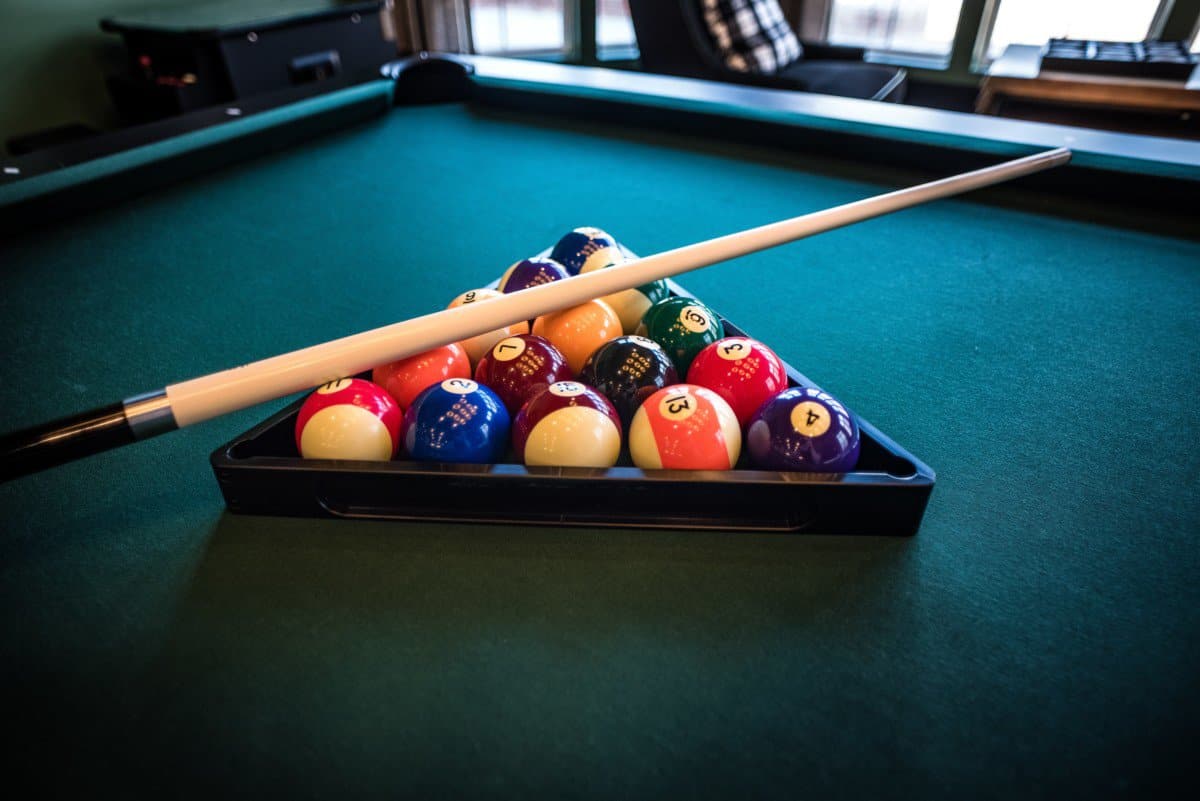 pool cue on top of balls