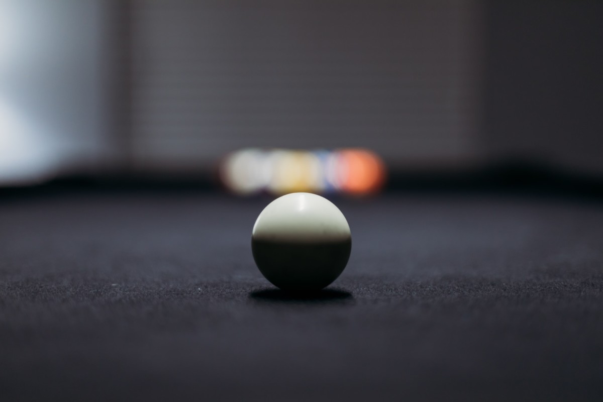 Zoomed in White Pool Ball on Black Table
